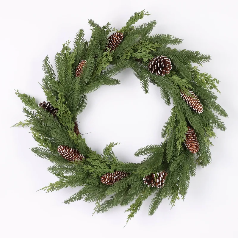 Green lush wreath with pine needles and pinecones